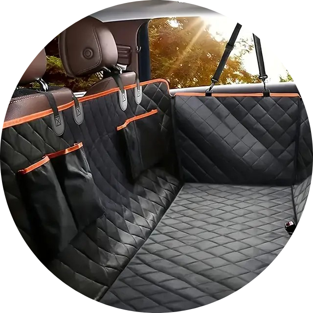 A soft-sided pet carrier sitting on a car backseat, unzipped at the top, with a small dog or cat peeking out, next to a travel water bottle and a leash.