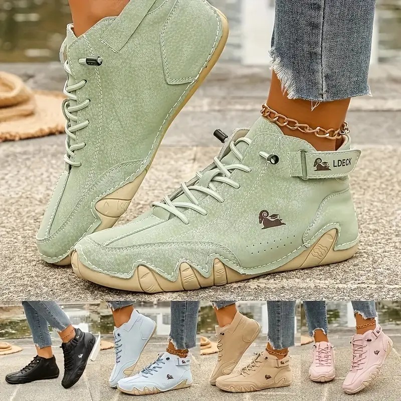 A pair of stylish women's fashion sneakers placed on a clean light background, showing a sleek silhouette, cushioned sole, and neutral color palette.