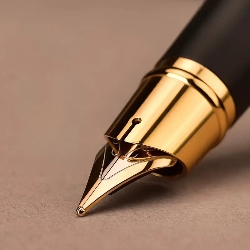 A flat lay of writing and correction supplies on a clean desk, including a notebook, a pen, a pencil, an eraser, and correction tape.